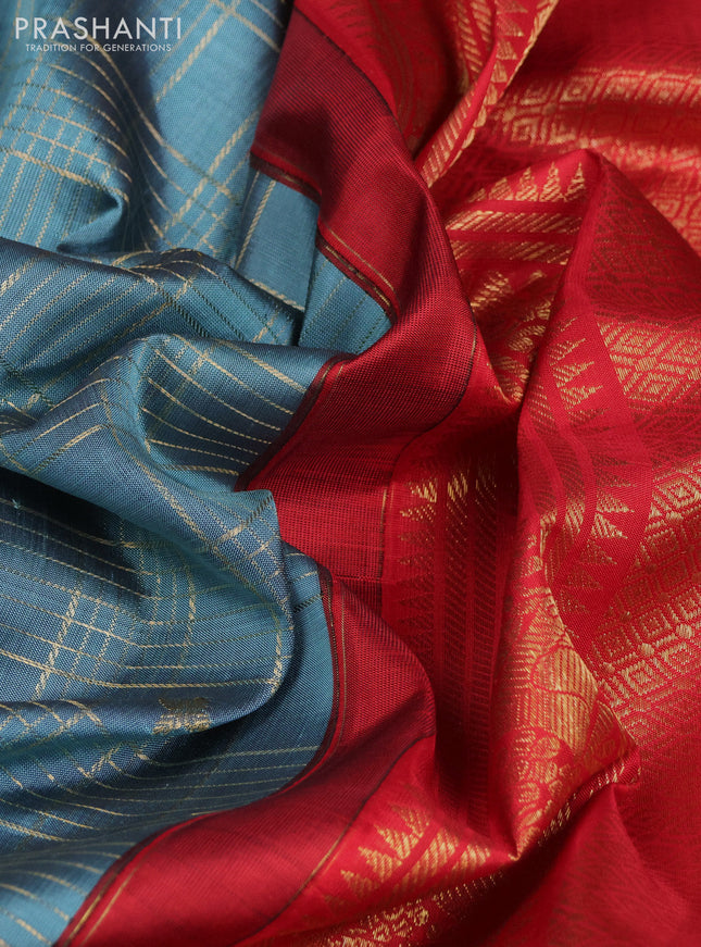 Pure kanchipuram silk saree pastel blue shade and red with allover zari checks & buttas and long zari woven border