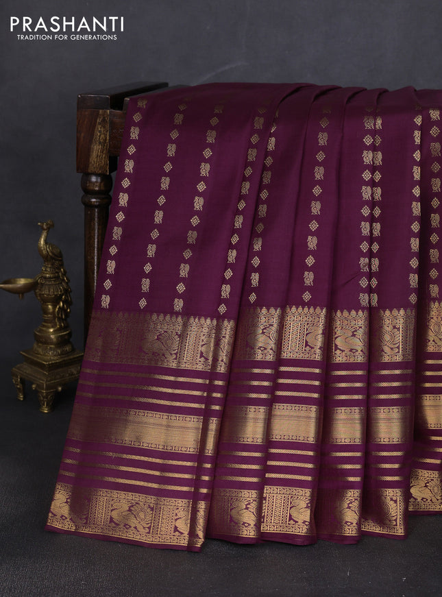 Pure kanchipuram silk saree wine shade with allover zari woven butta weaves and long rich zari woven border
