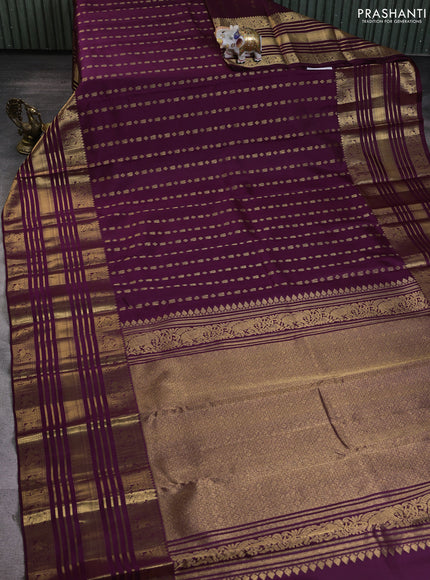 Pure kanchipuram silk saree wine shade with allover zari woven butta weaves and long rich zari woven border