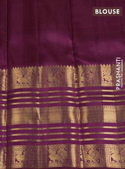 Pure kanchipuram silk saree wine shade with allover zari woven butta weaves and long rich zari woven border