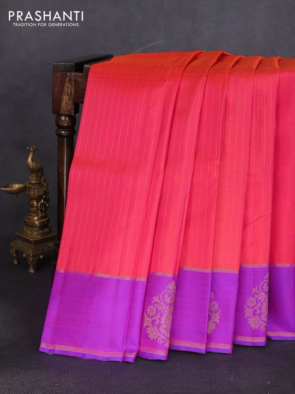Pure kanchipuram silk saree dual shade of orange and purple with allover zari stripe pattern and zari woven butta border