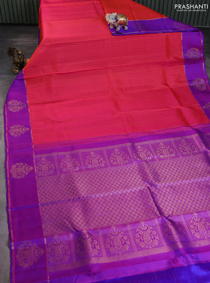 Pure kanchipuram silk saree dual shade of orange and purple with allover zari stripe pattern and zari woven butta border