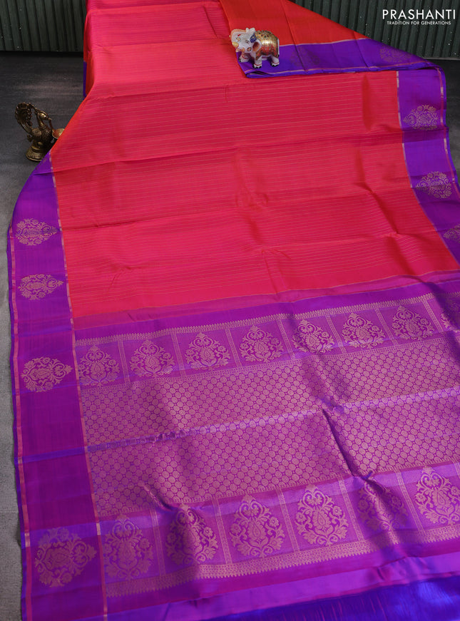 Pure kanchipuram silk saree dual shade of orange and purple with allover zari stripe pattern and zari woven butta border
