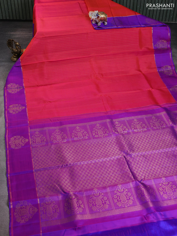 Pure kanchipuram silk saree dual shade of orange and purple with allover zari stripe pattern and zari woven butta border