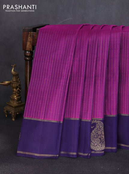 Pure kanchipuram silk saree purple and dark blue with allover zari stripe pattern and zari woven paisley butta border