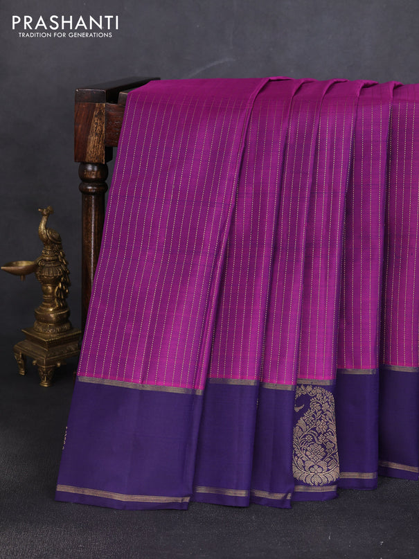 Pure kanchipuram silk saree purple and dark blue with allover zari stripe pattern and zari woven paisley butta border
