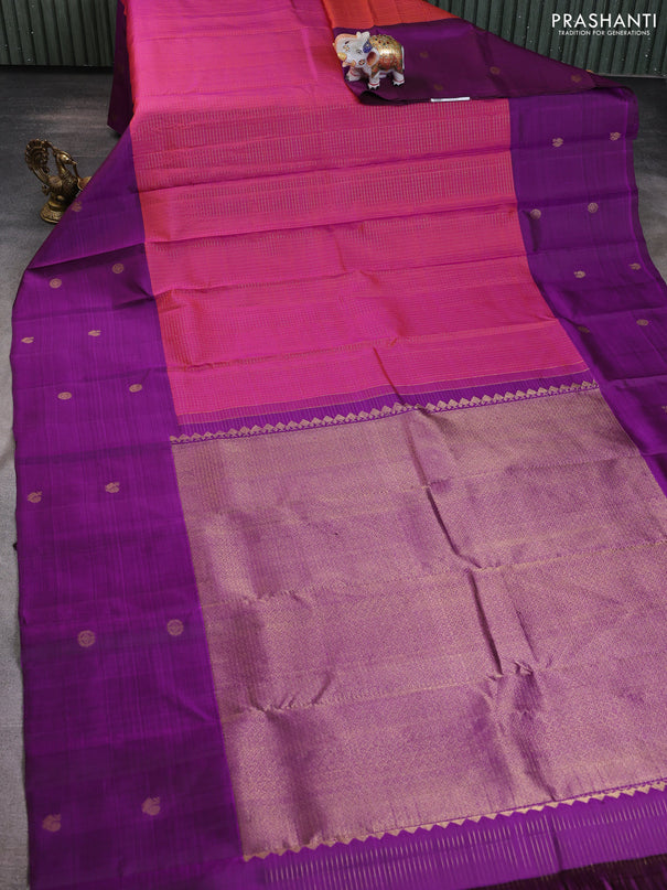 Pure kanchipuram silk saree dual shade of pinkish orange and purple with allover small zari checked pattern and long zari woven butta border