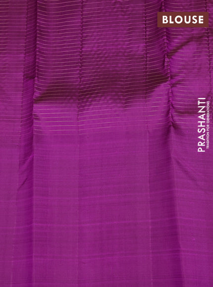 Pure kanchipuram silk saree dual shade of pinkish orange and purple with allover small zari checked pattern and long zari woven butta border