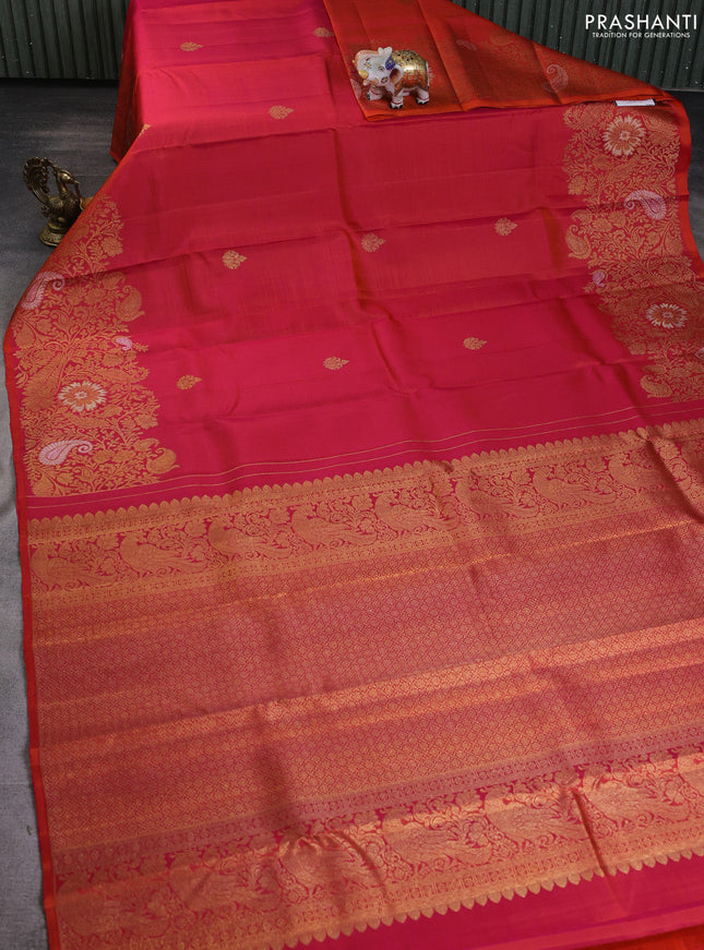 Pure kanchipuram silk saree dual shade of pinkish orange with zari woven buttas and long zari woven border