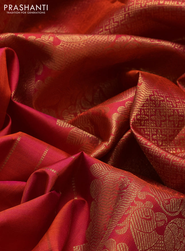 Pure kanchipuram silk saree dual shade of pinkish orange with zari woven buttas and long zari woven border