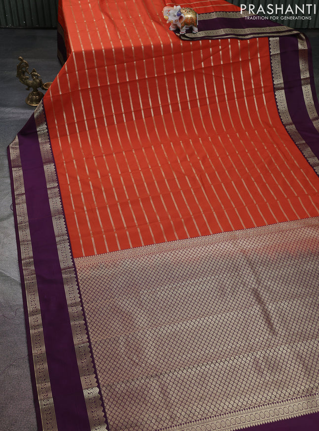 Semi kanchipuram silk saree rust shade and purple with allover zari weaves and rettapet zari woven korvai border