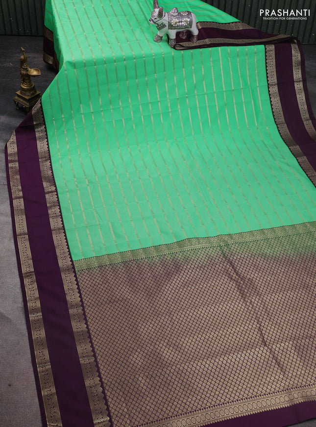 Semi kanchipuram silk saree green and purple with allover zari weaves and rettapet zari woven korvai border