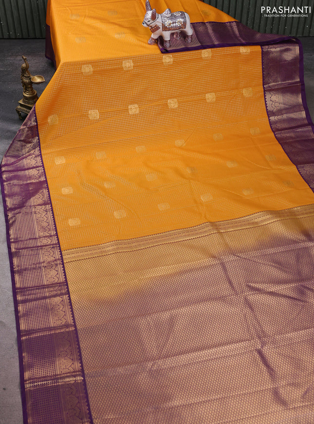 Semi kanchipuram silk saree mustard yellow and purple with allover zari checks & buttas and zari woven border
