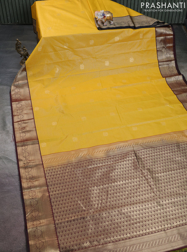 Semi kanchipuram silk saree yellow and deep maroon with allover zari small checks & buttas and zari woven border