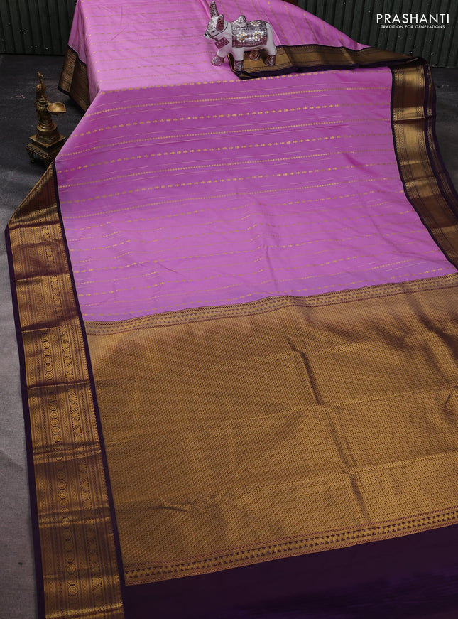 Semi kanchipuram silk saree lavender and purple with allover zari weaves & buttas and zari woven korvai border