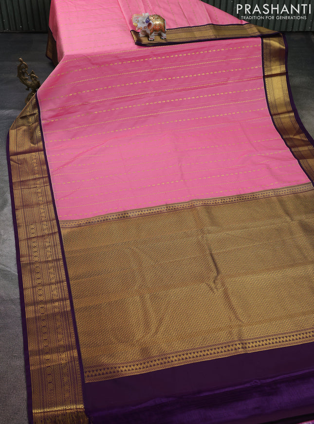 Semi kanchipuram silk saree peach pink and purple with allover zari weaves & buttas and zari woven korvai border