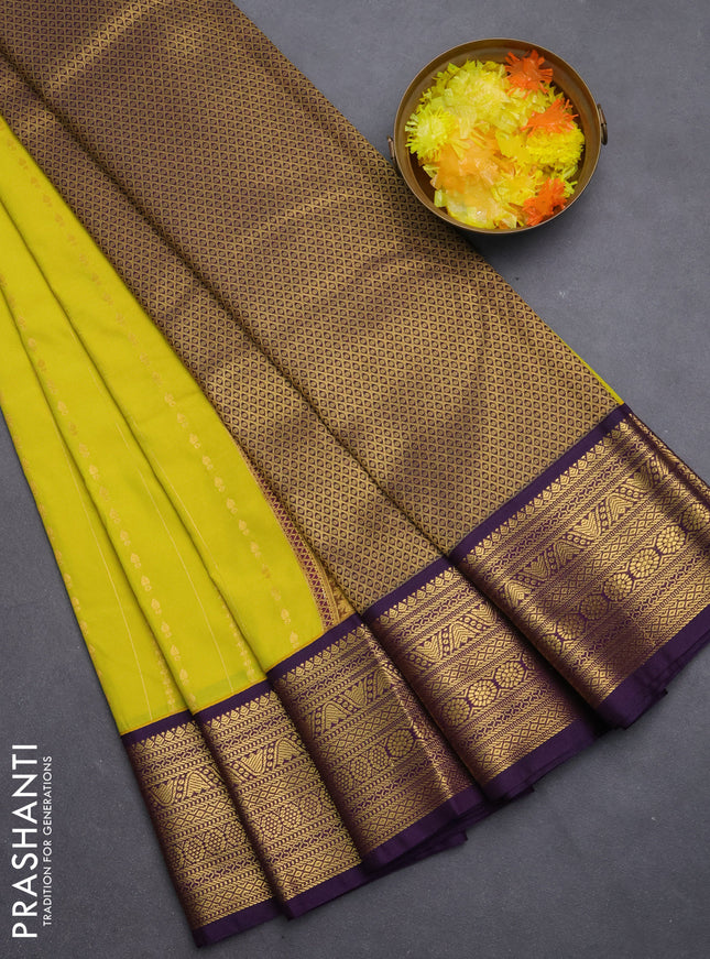 Semi kanchipuram silk saree lime yellow and purple with allover zari weaves & buttas and zari woven korvai border