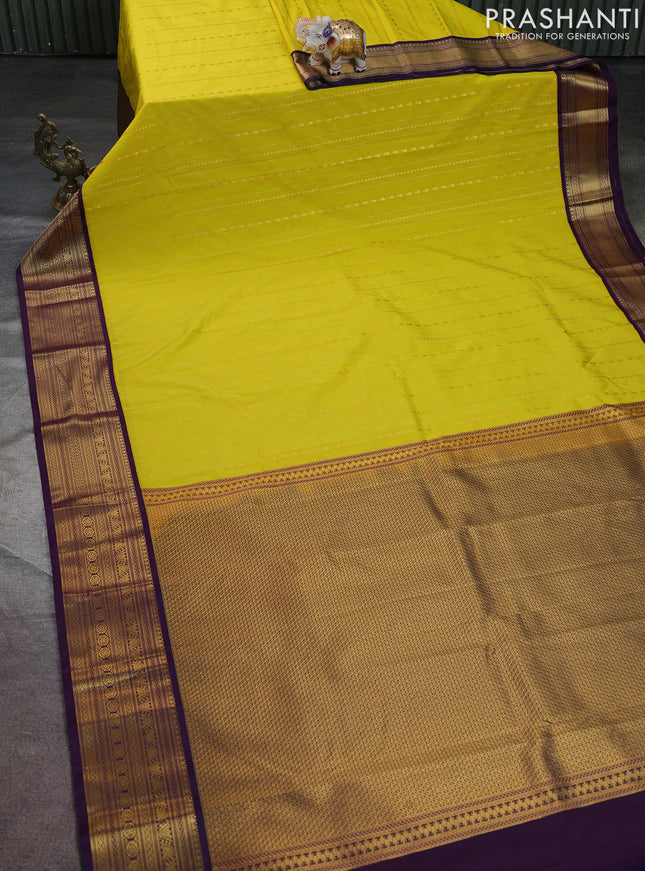 Semi kanchipuram silk saree lime yellow and purple with allover zari weaves & buttas and zari woven korvai border