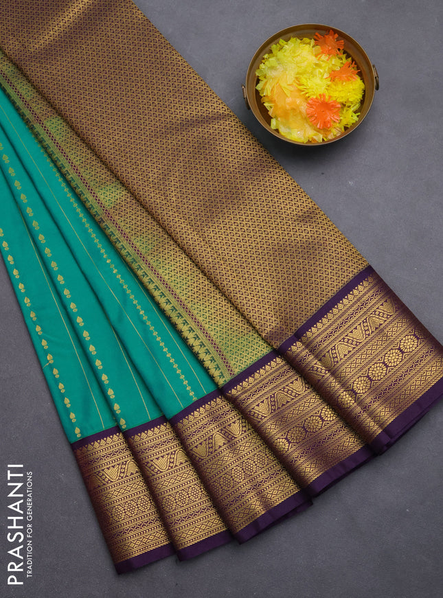 Semi kanchipuram silk saree green and purple with allover zari weaves & buttas and zari woven korvai border