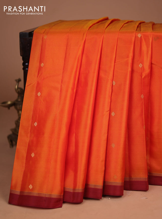 Pure kanchipuram silk saree orange and rust shade with zari woven buttas and zari woven simple border