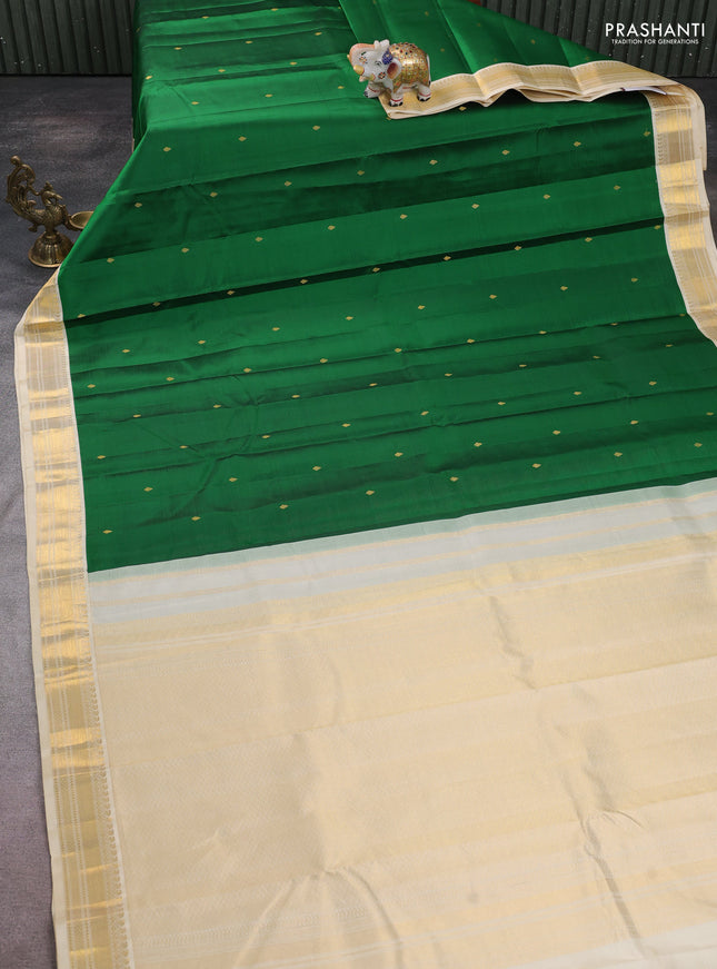 Pure kanchipuram silk saree green and cream with zari woven buttas and zari woven korvai border
