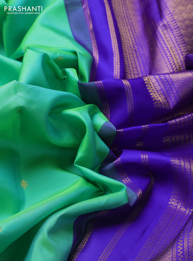 Pure kanchipuram silk saree teal green and royal blue with zari woven buttas and zari woven korvai border