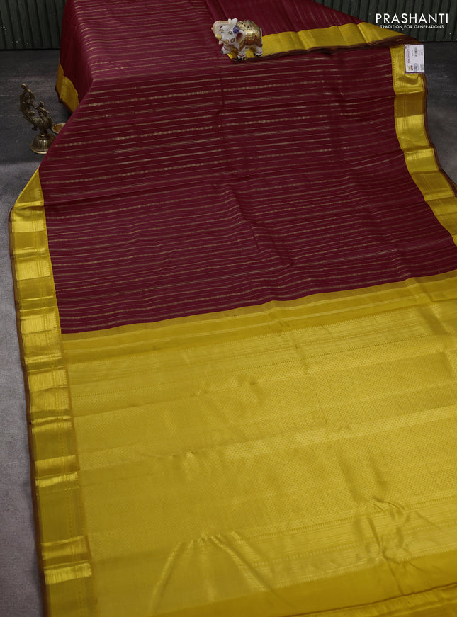 Pure kanchipuram silk saree maroon and yellow with allover zari weaves and zari woven korvai border