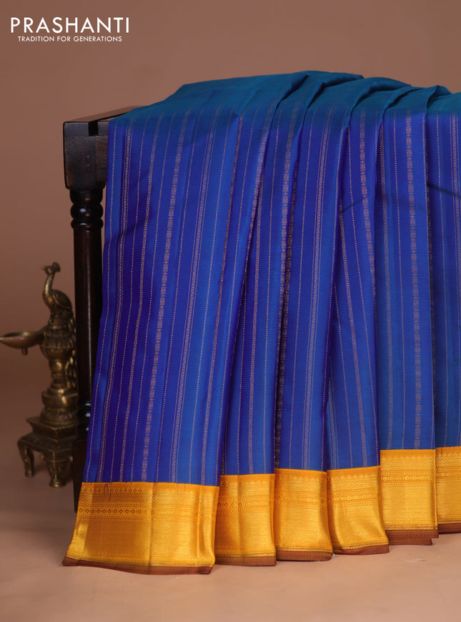 Pure kanchipuram silk saree peacock blue and yellow with allover zari weaves and zari woven korvai border