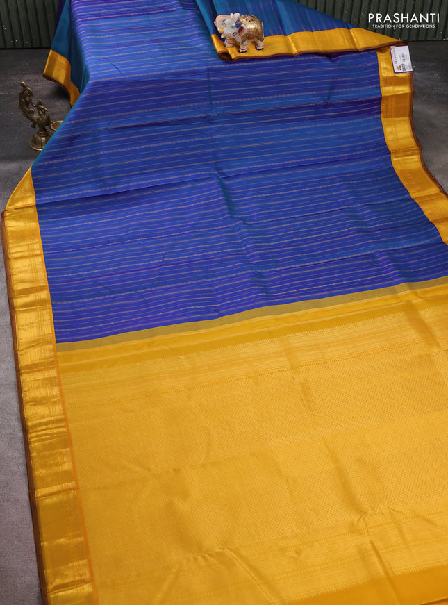 Pure kanchipuram silk saree peacock blue and yellow with allover zari weaves and zari woven korvai border