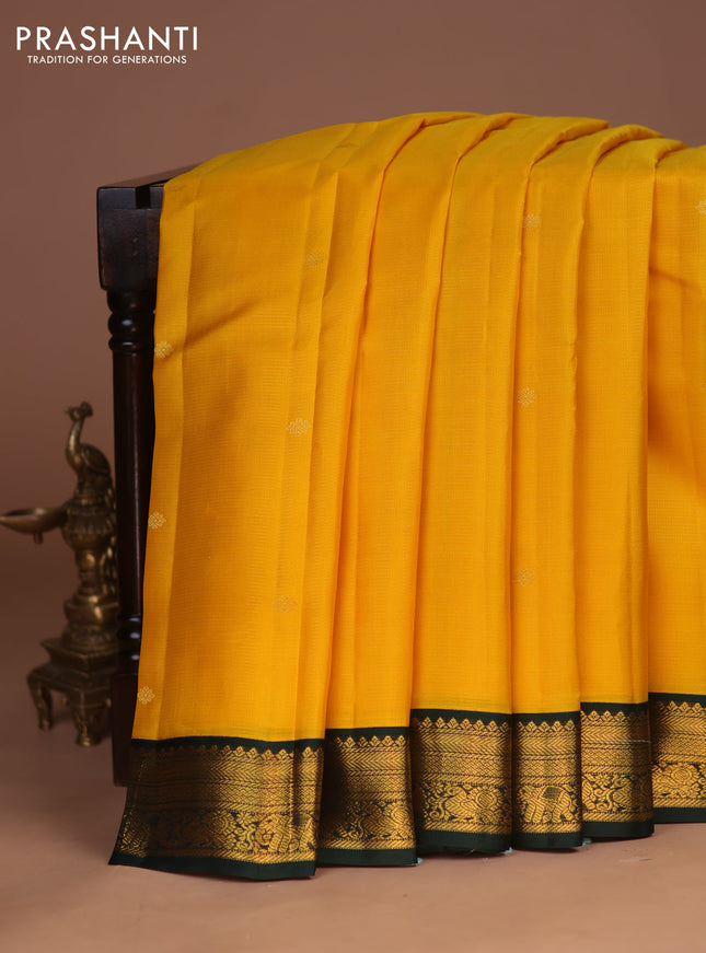 Pure kanchipuram silk saree yellow and bottle green with allover zari weaves & buttas and zari woven korvai border