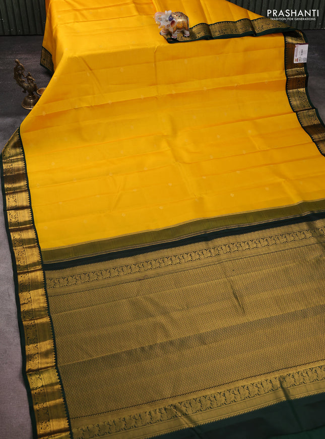 Pure kanchipuram silk saree yellow and bottle green with allover zari weaves & buttas and zari woven korvai border