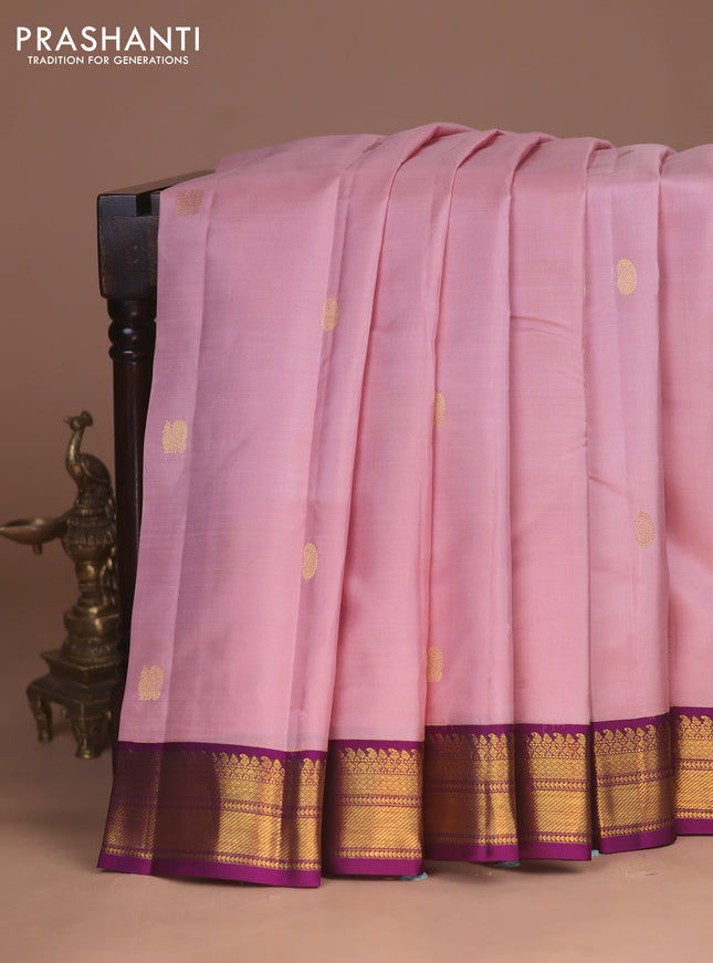 Pure kanchipuram silk saree mild peach pink and purple with zari woven buttas and zari woven korvai border