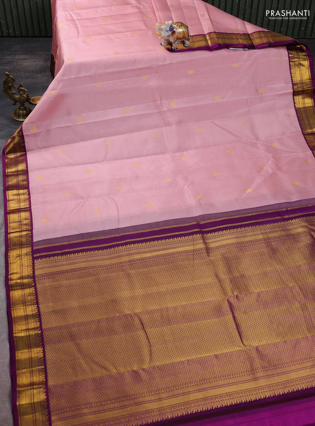 Pure kanchipuram silk saree mild peach pink and purple with zari woven buttas and zari woven korvai border