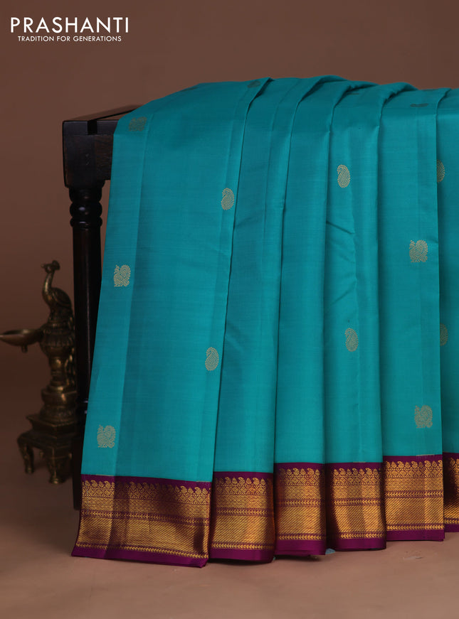 Pure kanchipuram silk saree teal blue and purple with zari woven buttas and zari woven korvai border
