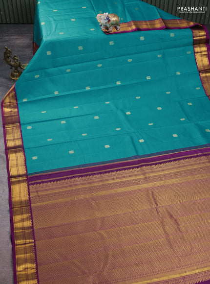 Pure kanchipuram silk saree teal blue and purple with zari woven buttas and zari woven korvai border