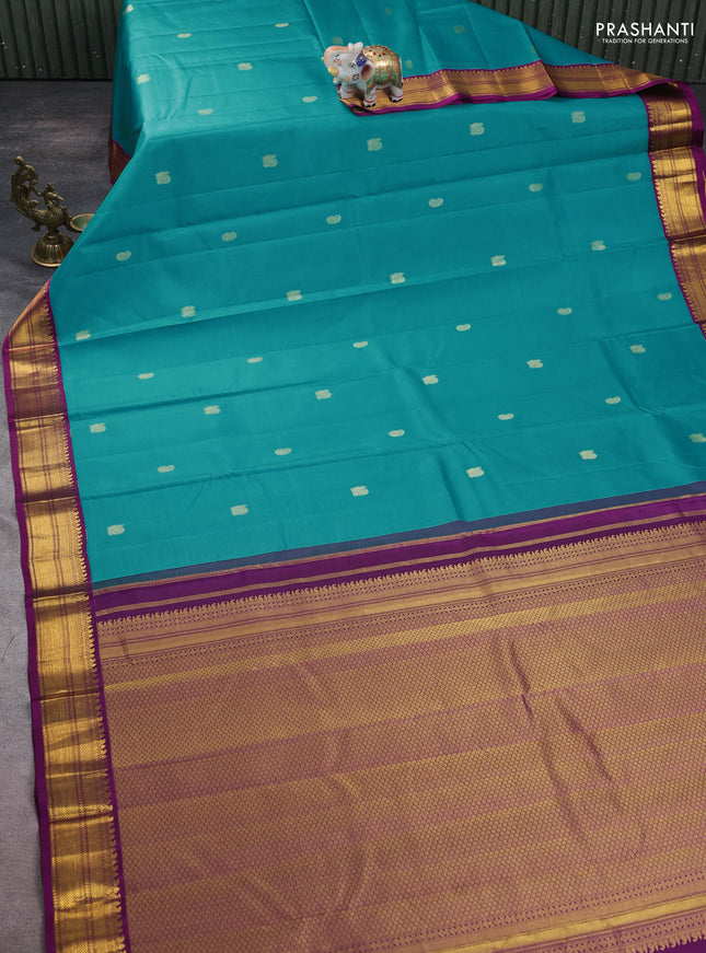 Pure kanchipuram silk saree teal blue and purple with zari woven buttas and zari woven korvai border