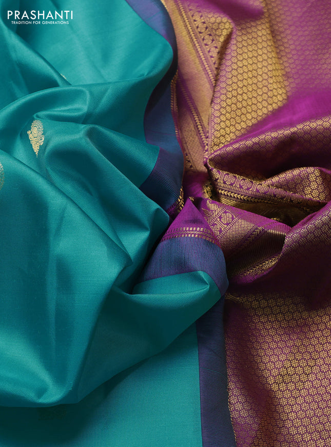 Pure kanchipuram silk saree teal blue and purple with zari woven buttas and zari woven korvai border