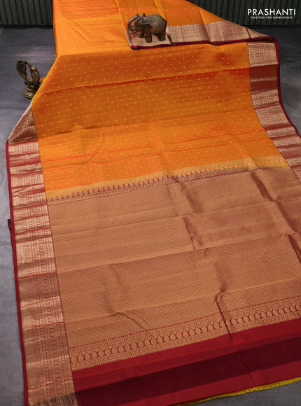Pure kanchipuram silk saree sunset orange and maroon with allover zari woven buttas and zari woven korvai border