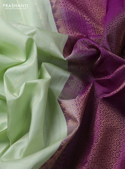 Pure kanchipuram silk saree pista green and purple with allover zari weaves and simple border