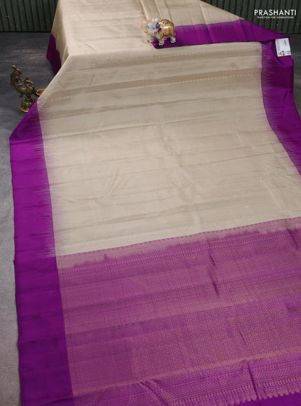 Pure kanchipuram silk saree beige and purple with allover zari weaves and simple border