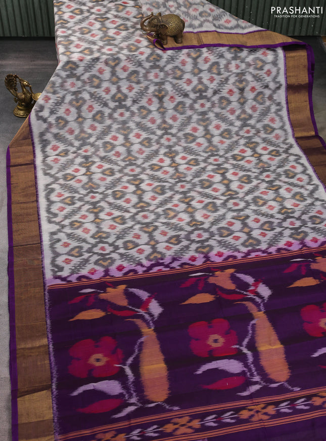 Ikat silk cotton saree off white and purple with allover ikat weaves and zari woven border
