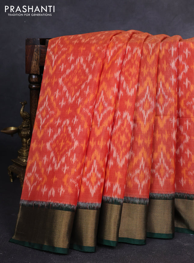 Ikat silk cotton saree orange and bottle green with allover ikat weaves and zari woven border
