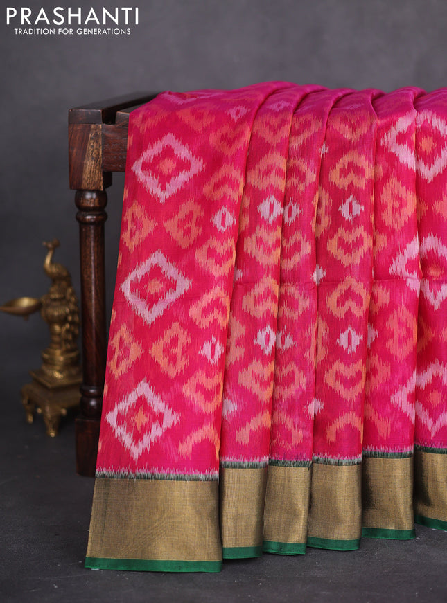Ikat silk cotton saree magenta pink and bottle green with allover ikat weaves and zari woven border