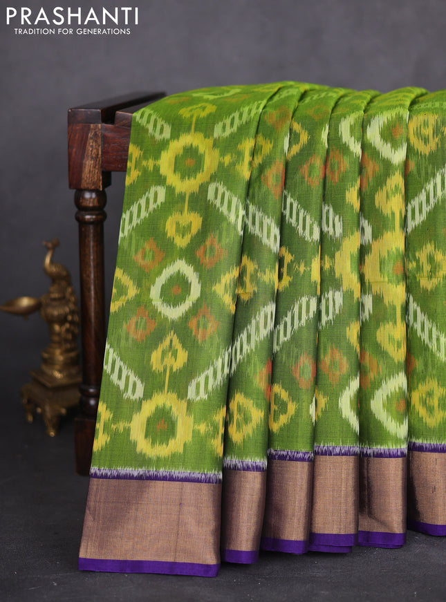 Ikat silk cotton saree green and violet with allover ikat weaves and zari woven border