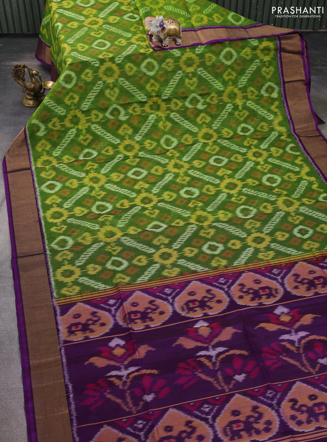 Ikat silk cotton saree green and purple with allover ikat weaves and zari woven border