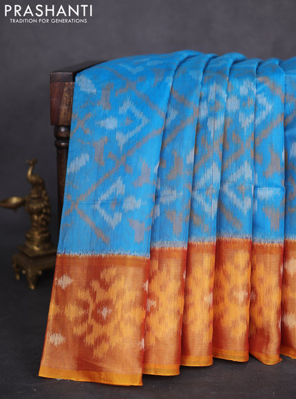 Ikat silk cotton saree blue and rustic orange with allover ikat weaves and long zari woven ikat border