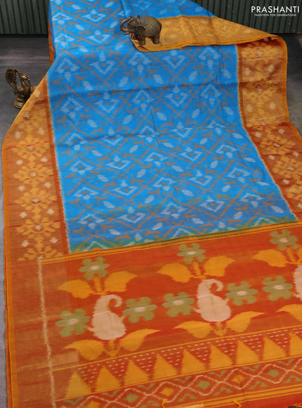Ikat silk cotton saree blue and rustic orange with allover ikat weaves and long zari woven ikat border