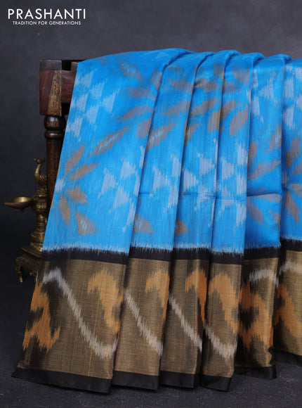 Ikat silk cotton saree light blue and black with allover ikat weaves and long zari woven ikat border