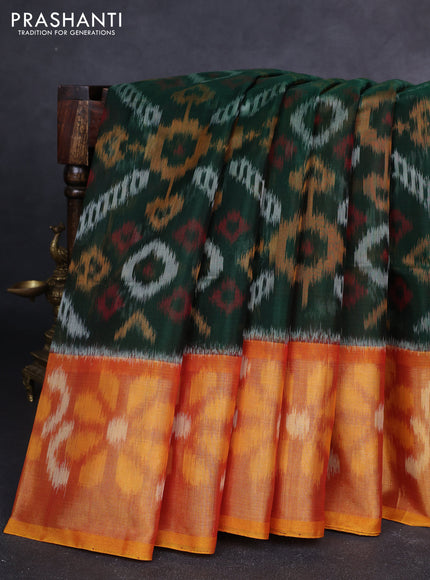 Ikat silk cotton saree bottle green and rustic orange with allover ikat weaves and long zari woven ikat border