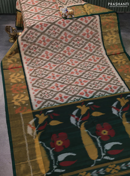Ikat silk cotton saree beige and bottle green with allover ikat weaves and long zari woven ikat border